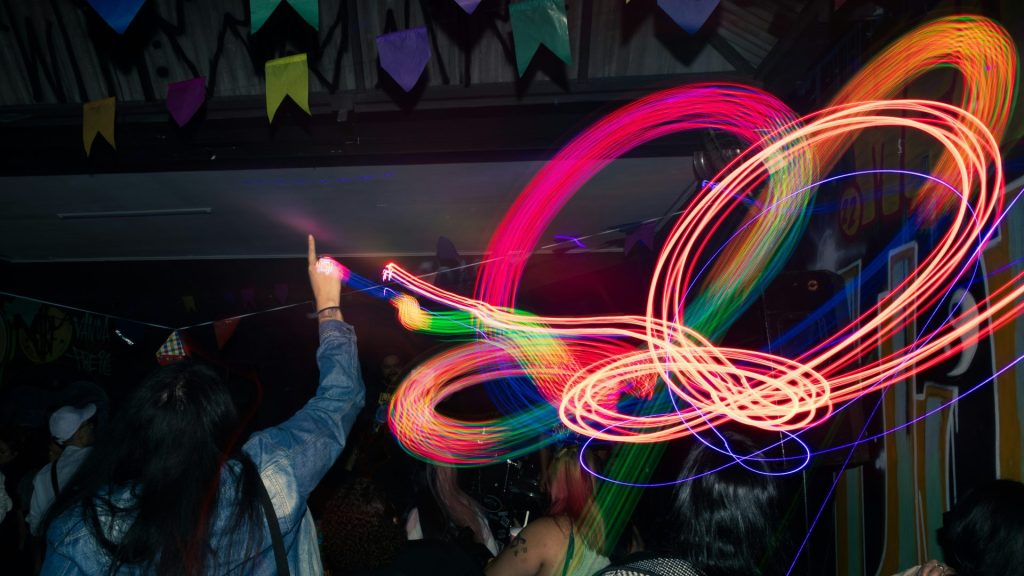 A blurry photo of a person holding a light wand